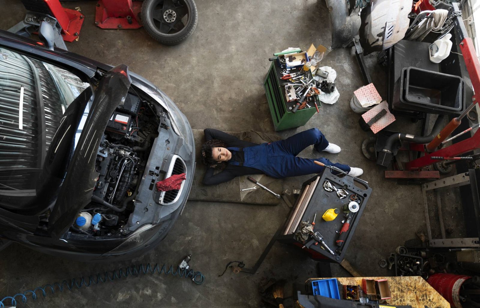 Home Top View Woman Repairing Car Scaled