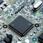 closeup of electronic circuit board with cpu microchip electronic components background